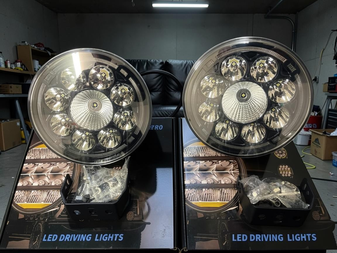 Zoom Tyres Otahuhu pair of 7 inch round LED driving lights with projector lenses and halo rings in black housing